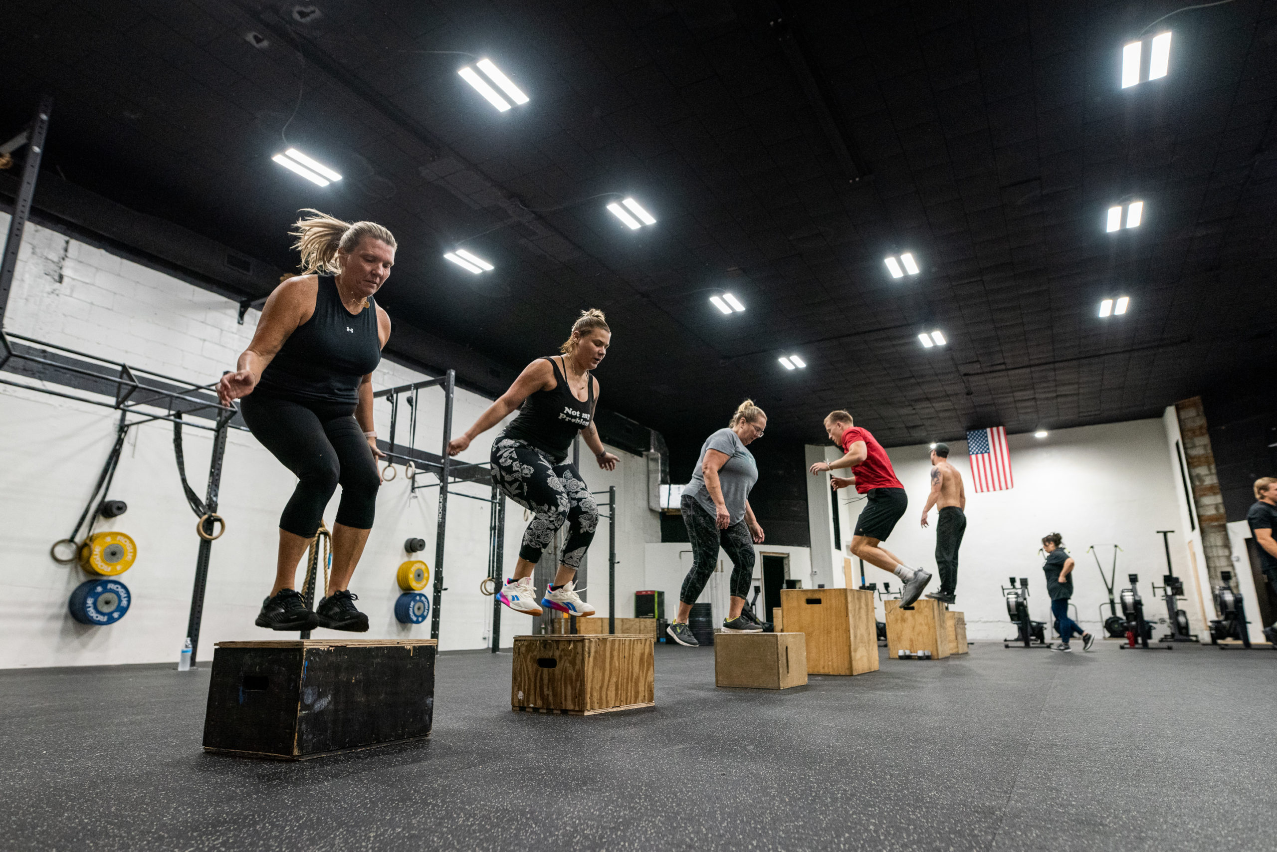 Women doing box jumps