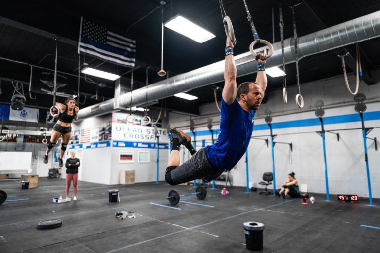 Athlete performing muscle-up on the rings