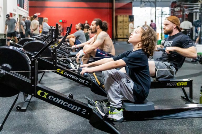 Young boy on a rowing machine